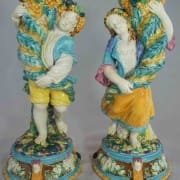 Boy and girl cornucopia vases