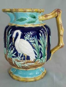 Stork in marsh pitcher with bamboo handle