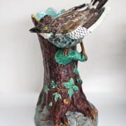 Bird on trunk walking stick stand